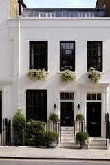 Charming white townhouse with black trim and flower boxes located in a quaint neighborhood, showcasing a peaceful urban setting during daytime