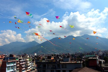 Colorful kites flying over kathmandu, nepal, with mountains and cloudy sky