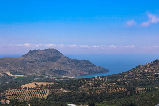 Panoramic aerial view of Plakias Bay and the mountainous south coast of Crete, Greece. Summer landscape with olive groves, turquoise sea, and clear blue sky in Rethymno region. Crete, July, 18, 2025