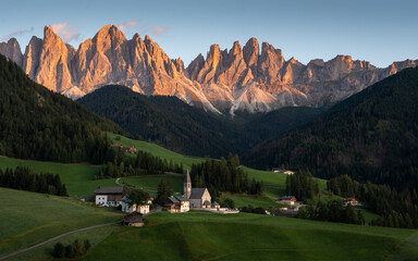 Beautiful sunset at Santa Maddalena village in the Dolomites, Val di Funes, Italy.