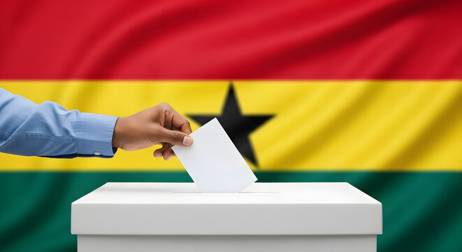 A person's hand casting a ballot into a white ballot box, with the Ghana flag in the background.
