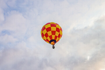 Red and yellow hot air balloon in the sky