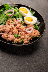 Tuna salad egg, arugula, vegetables tasty snack fresh delicious gourmet food background on the table rustic food top view copy space keto and paleo diet food pescetarian diet