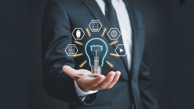 Businessman holding lightbulb with technology icons symbolizing innovative solutions and digital transformation