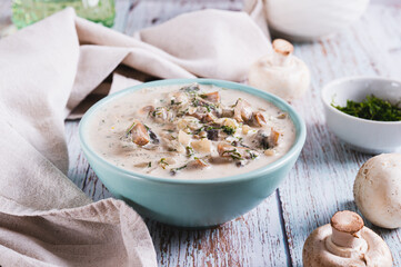 Spicy mushroom sauce with herbs in a bowl on the table