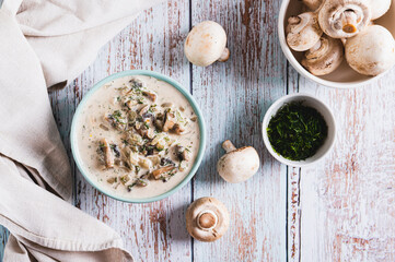 Spicy mushroom sauce with herbs in a bowl on the table top view