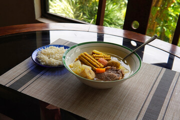 Olla de carne beef soup with vegetables, corn, potato, chayote, plantain, carrot, and beef. Typical dish of Costa Rica and Central America. Beef broth or meat soup accompanied with white rice.