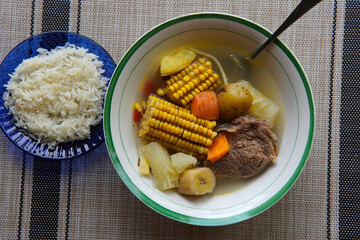 Olla de carne beef soup with vegetables, corn, potato, chayote, plantain, carrot, and beef. Typical dish of Costa Rica and Central America. Beef broth or meat soup accompanied with white rice.