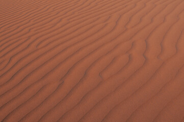 Natural designs and shapes in the sand, caused by the wind.