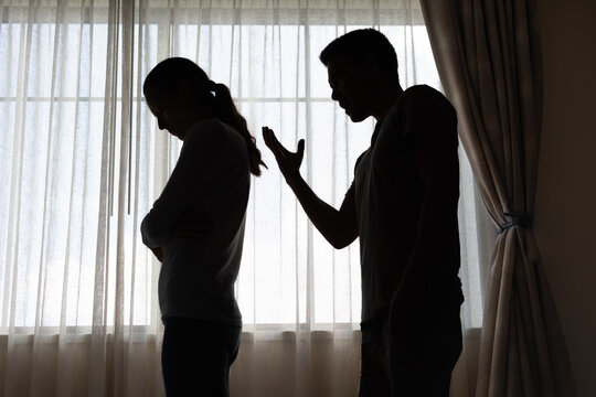 unhappy crying frightened woman, aggressive man quarreling at home. Angry husband emotionally arguing screaming shouting to scared wife psychological emotional abuse, domestic violence relationship	