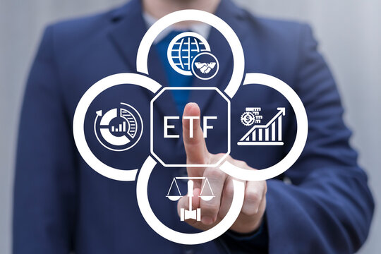 Person using virtual touch screen presses acronym: ETF. Analytics of ETF data, stock charts, financial market investment concept. Buying strategic ETF Exchange traded fund stock market trading.