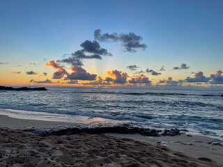 sunset on the beach in Honolulu, Hawaii at Waimea Point, Kalahopele gulch, Three Tables Beach