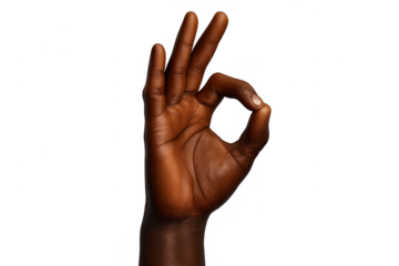 Dark-skinned hand making 'OK' gesture, perfectly isolated on transparent background.