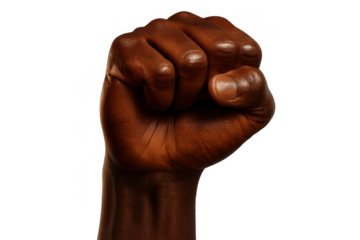 Strong dark-skinned raised fist, isolated on transparent background.