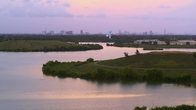 &ldquo;Drone view of bayou reservoir in Southwest Houston with cityscape background