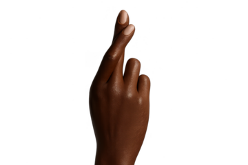 Dark-skinned hand with fingers crossed, isolated on transparent background.