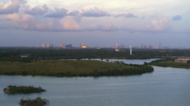 &ldquo;Drone view of bayou reservoir in Southwest Houston with cityscape background