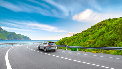 car drive on nature road in mediterranean beach in summer. coastal road landscape in nature trip. europe travel in summer road scenery. Sunset landscape on the highway in ocean beach