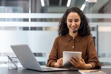 Friendly customer service agent using technology at a modern office desk