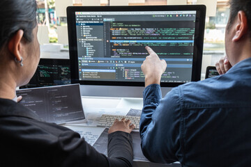 Team of developer programmer working on project in software development computer in IT company office, Writing codes and data code website and coding database technologies to find problem solution