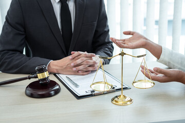 Male lawyer or counselor discussing negotiation legal case with client meeting with document contract in office, law and justice, attorney, lawsuit concept