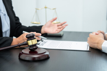 Male lawyer or counselor discussing negotiation legal case with client meeting with document contract in office, law and justice, attorney, lawsuit concept