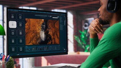 African American person uses AI chatbot to generate a video montage at home office, deep learning models and cloud technology for a personalized project, text to video. Camera A.