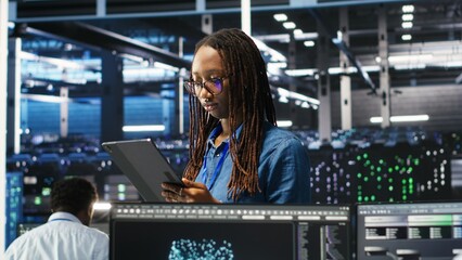 Server farm engineering team using AI algorithms and node tree systems to categorize unstructured data. Data center IT experts use visual programming and natural language processing software, camera B