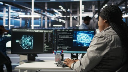 Obraz premium Data center employee deploying AI solutions optimizing equipment. Server farm software developer applying artificial intelligence technology minimizing infrastructure downtime, camera A