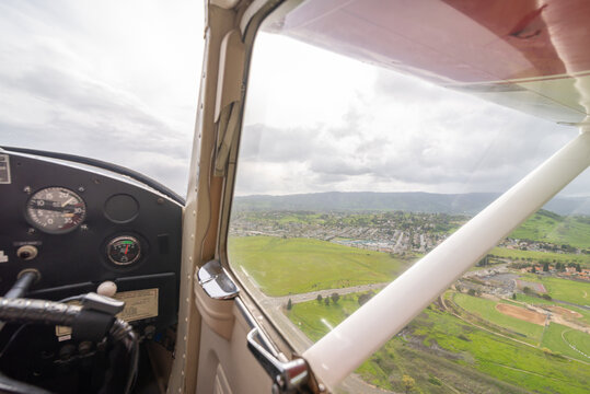 The view from the right side seat of a small single-engine plane in the Sacramento valley