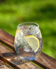 glass of water with ice and lemon