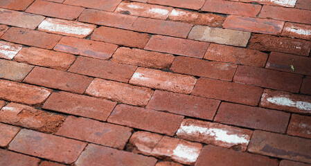 view of a red brick flooring outdoor on a sunny day