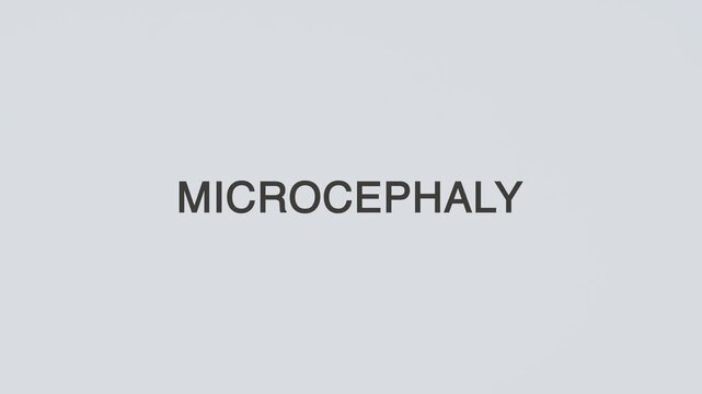 Microcephaly word diagnosed with a stethoscope held in hand on a white background, illustrating pediatric brain evaluation, medical assessment, developmental monitoring, and patient awareness