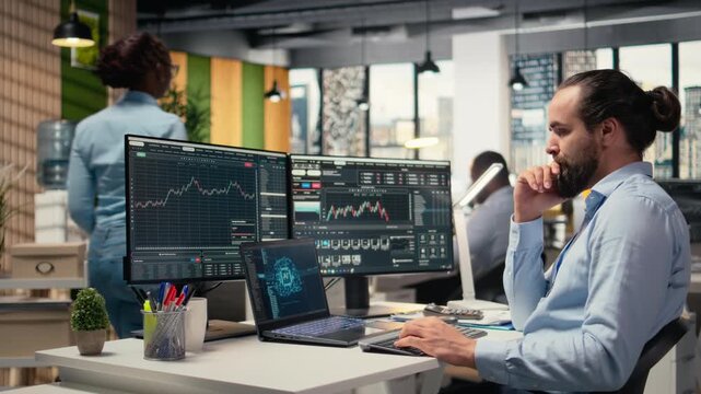 Trader in office leverages artificial intelligence on laptop to interpret charts, optimizing buying and selling. Stockbroker uses deep learning automatization on notebook to maximize profits, camera A