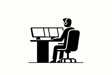 Fototapeta premium Person wearing headphones working at a multi-monitor computer setup