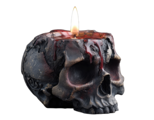 A skull-shaped candle with a flickering flame