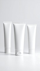 Three blank white tubes