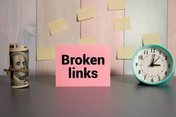 Broken links text n white sheet with notepad and hourglass