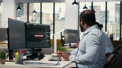 Teamworking traders in office work together to resolve security alert after hacker uses exploit to penetrate systems. Team of prop firm colleagues brainstorm how to protect from cyberattack, camera B - Powered by Adobe