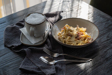 Pasta carbonara served in a cafe. 