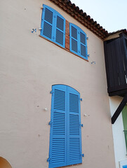 old house with blue shutters