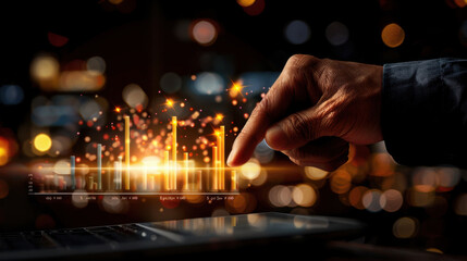 Hand interacts with digital graph displaying financial data, illuminated by glowing lights in blurred background. scene conveys sense of innovation and technology in data analysis