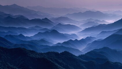 Serene vista of countless indigo mountain ranges layered in misty haze, fading into a soft purple dawn sky