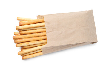 Delicious grissini sticks in paper bag isolated on white, top view