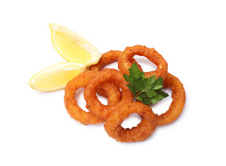Fried squid rings, lemon and parsley isolated on white, top view