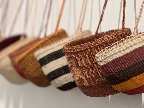 Large group of dilly bags hanged on a wall