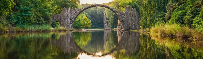 Fototapete Rakotzbrücke Rakotz Bridge (Rakotzbrucke, Devil's Bridge) in Kromlau, Saxony, Germany. Colorful summer, reflection of the bridge in the water create a full circle  © Pawel Pajor