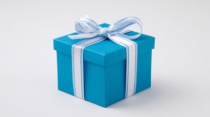 Obraz premium Elegant Blue Gift Box with White Ribbon on White Background
