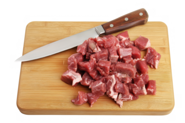 Rectangular wooden cutting board with diced red meat and a knife on transparent background