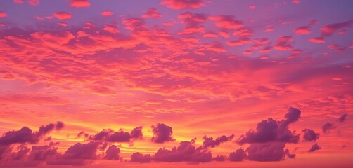 Fiery orange, pink, and purple hues paint the twilight sky, clouds ablaze with color,  rays,  clouds